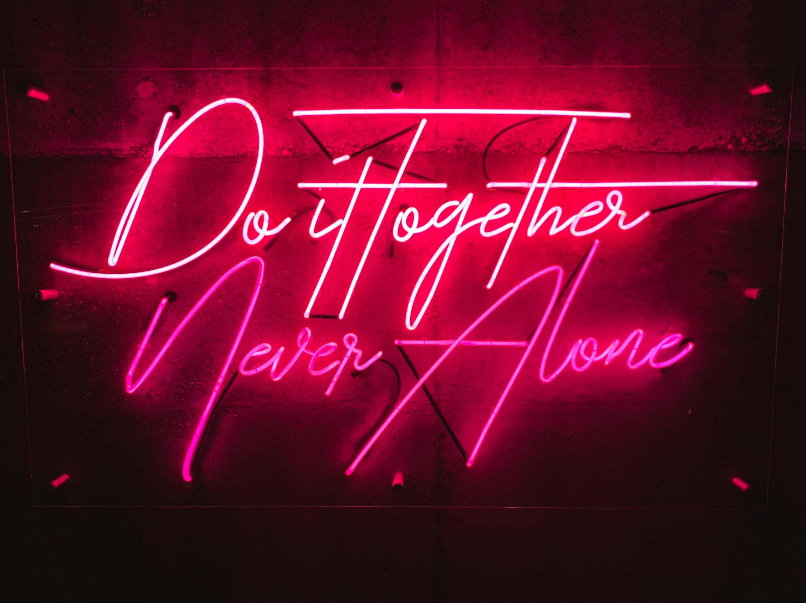 cory-billingsley-PQ36AkKJfAc-unsplash neon sign saying do it together never alone